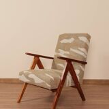 Pair of vintage lounge chairs in brown jacquard fabric and wood.