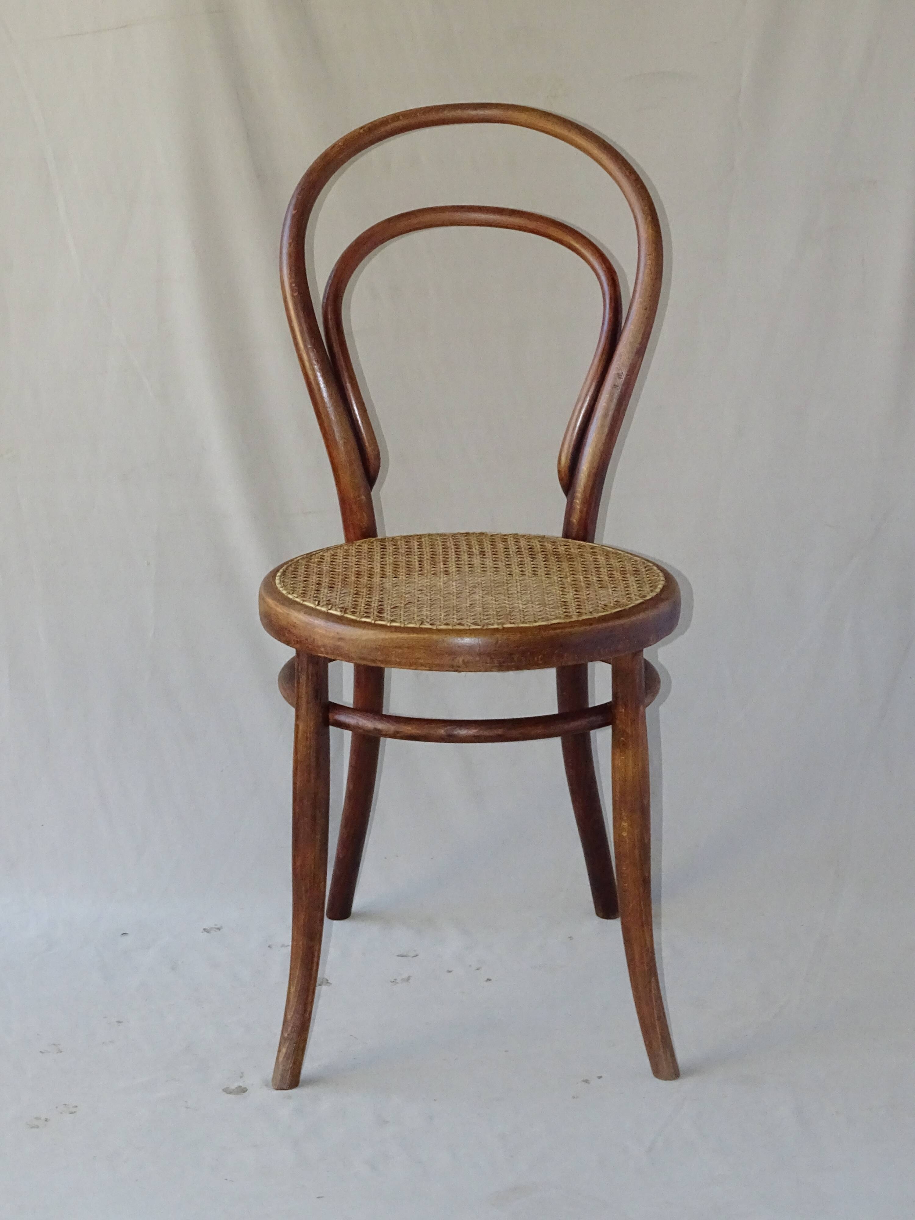 Two Turpe canned Bistro 1900 color rosewood chairs