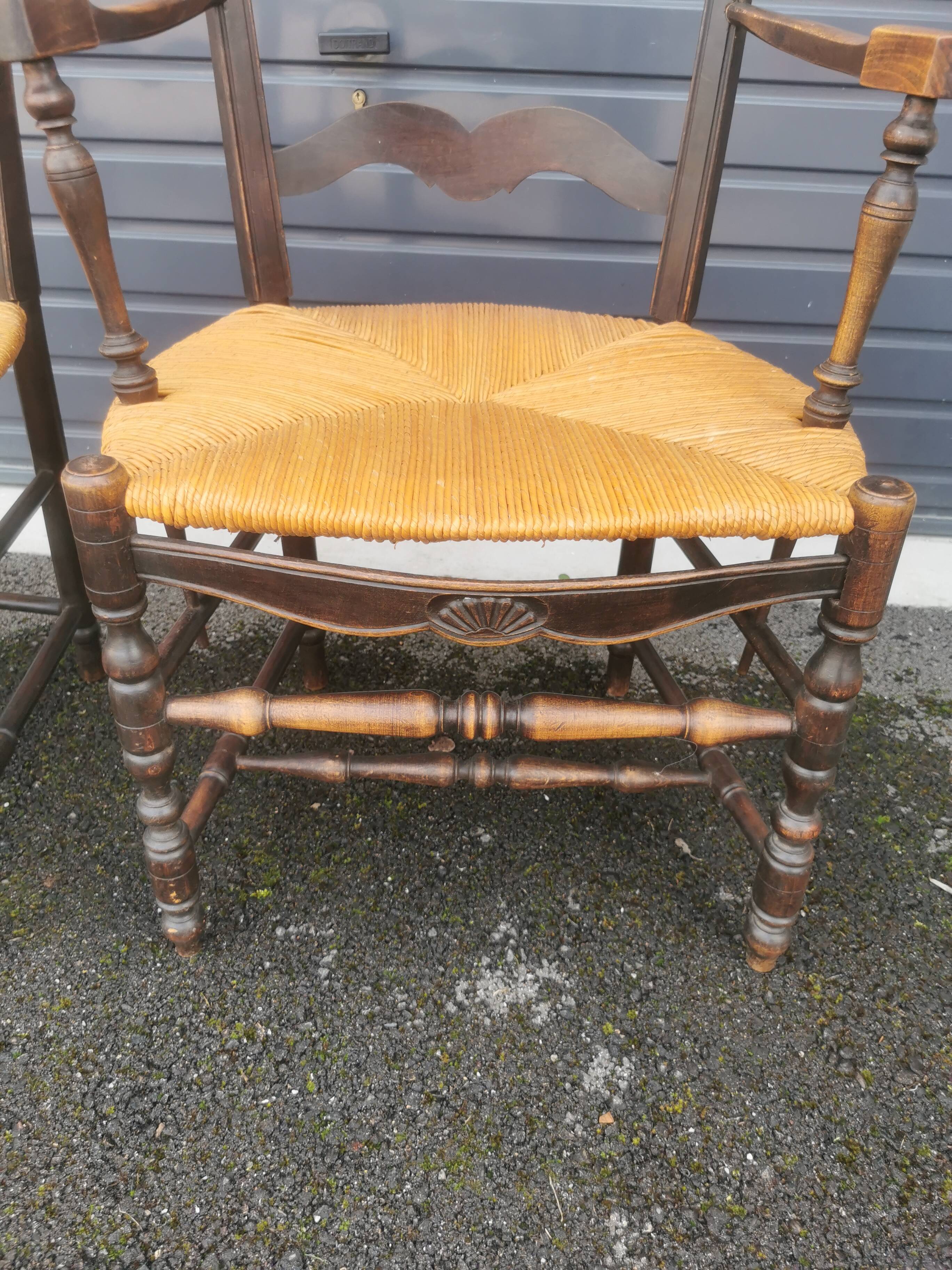 Pair of blackened wooden armchairs
