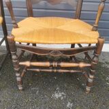 Pair of blackened wooden armchairs