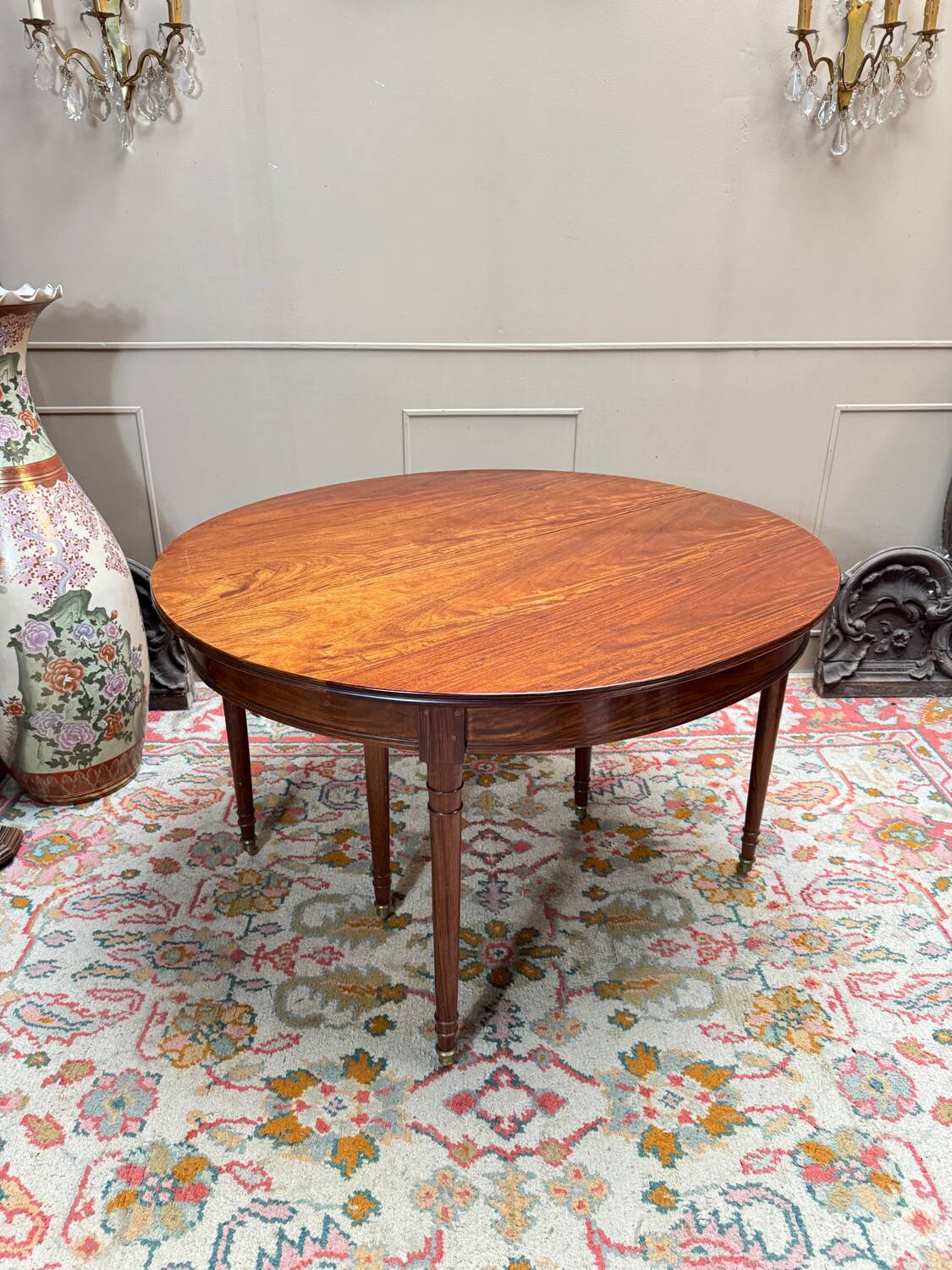 Dining table with a mahogany band in louis xvi style