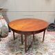 Dining table with a mahogany band in louis xvi style