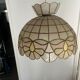 Mother-of-pearl and brass suspension