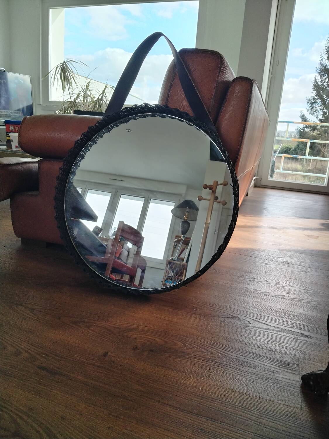 Old rattan mirror with leather strap