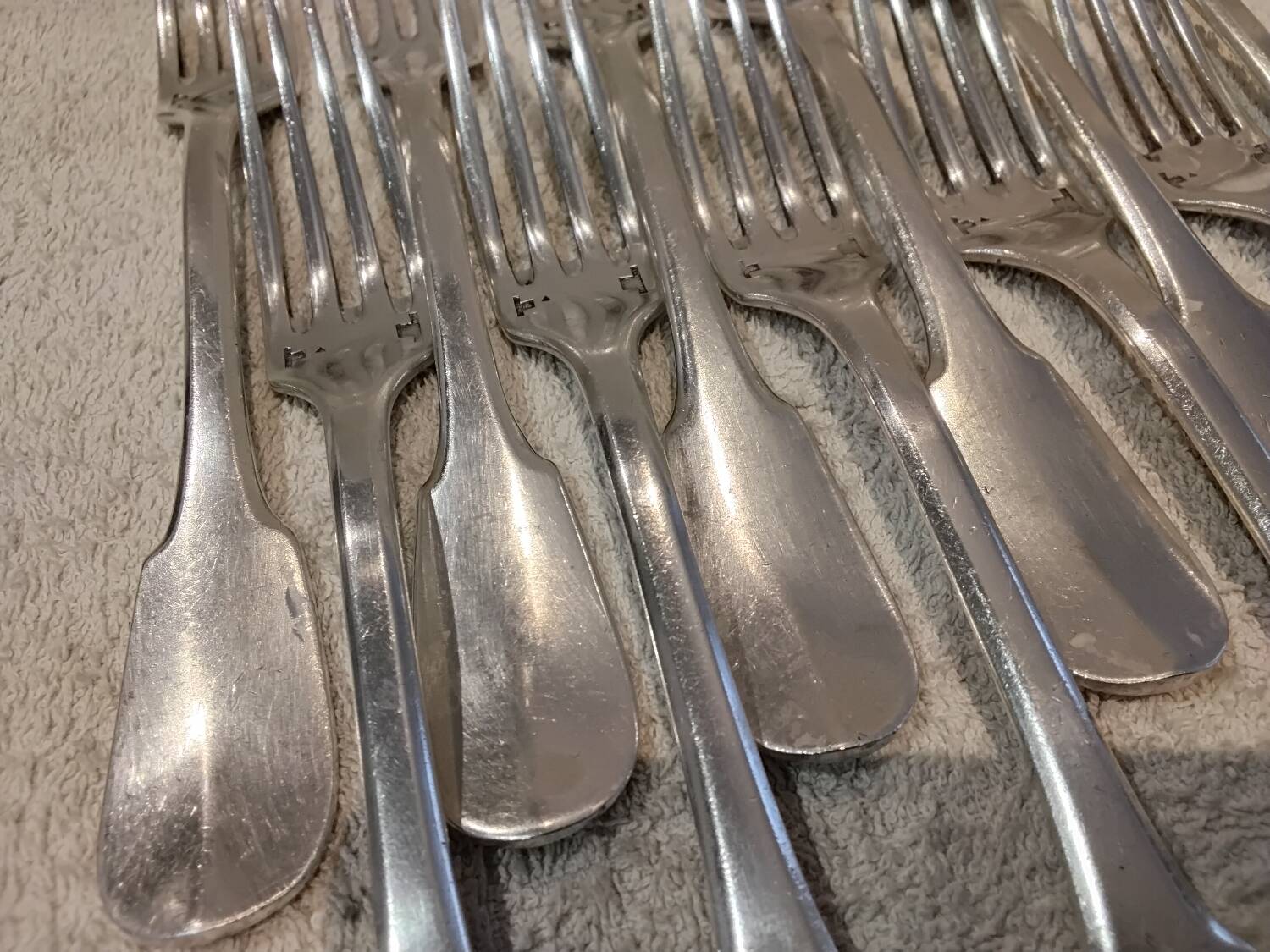 11 silver-plated table forks by Christofle Cluny with stripes