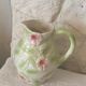 Ceramic dabbling jug enamelled floral motif
