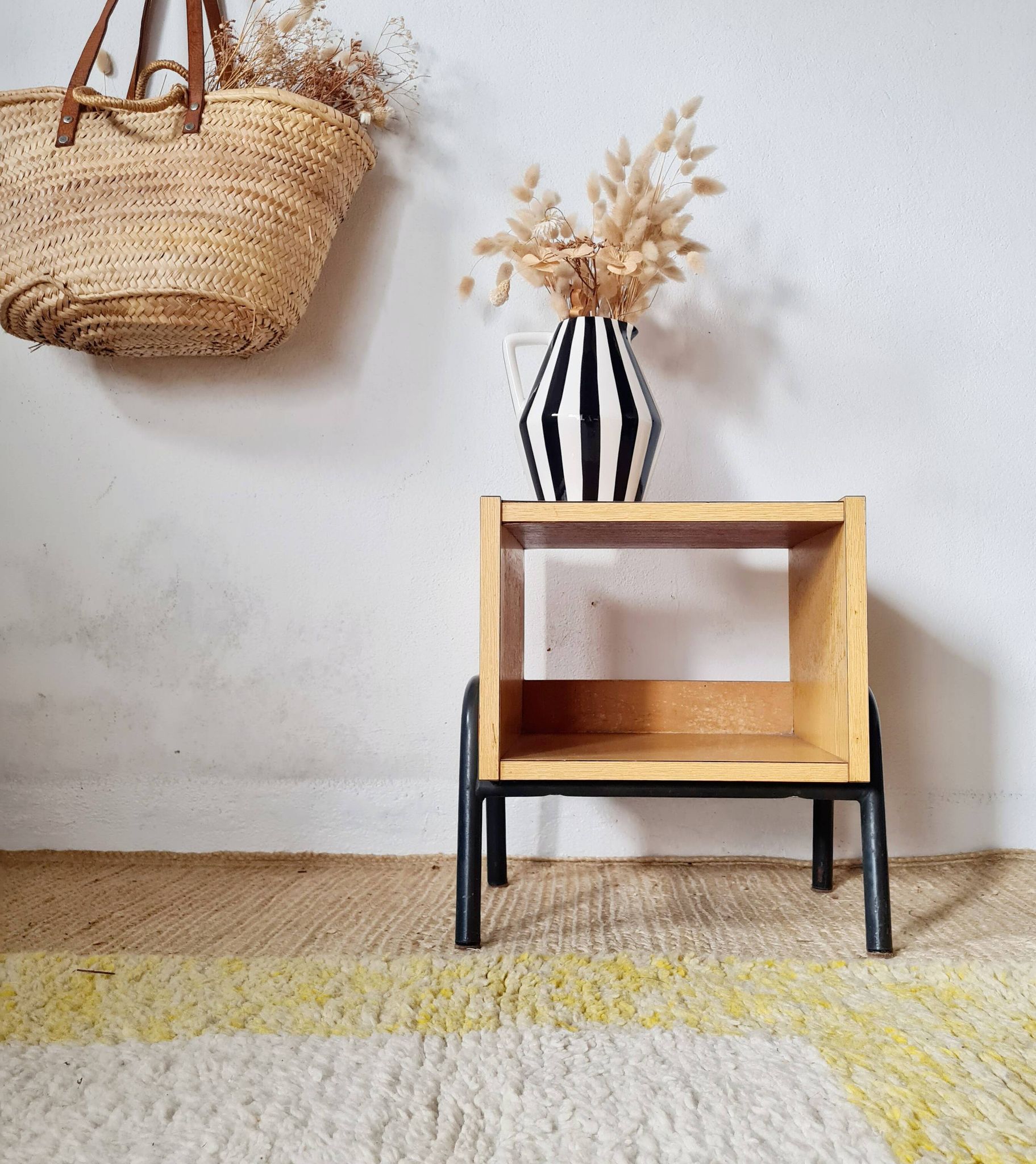 Bedside table - small wooden piece of furniture with a tubular metal base.