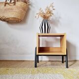 Bedside table - small wooden piece of furniture with a tubular metal base.