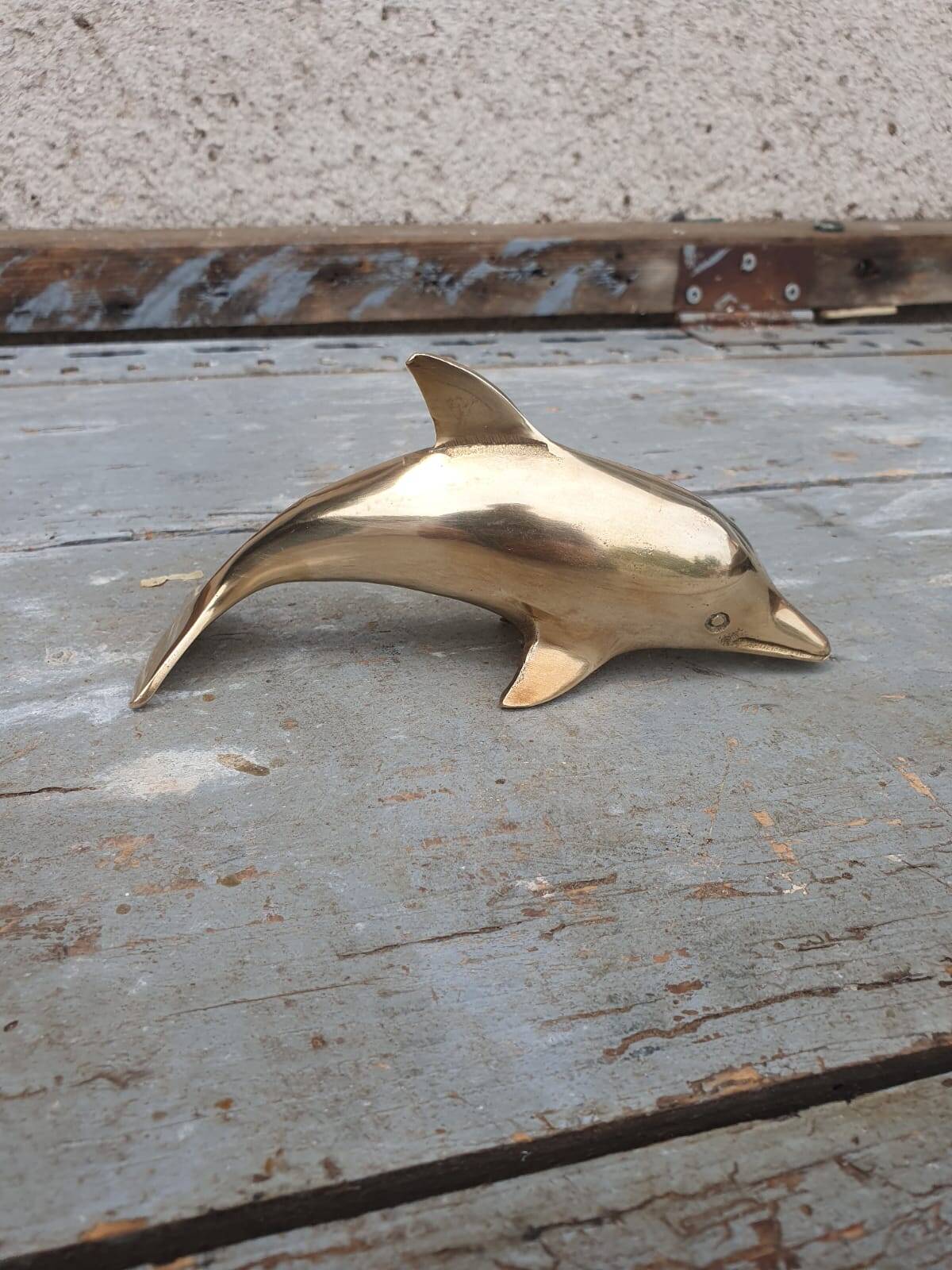 brass dolphin