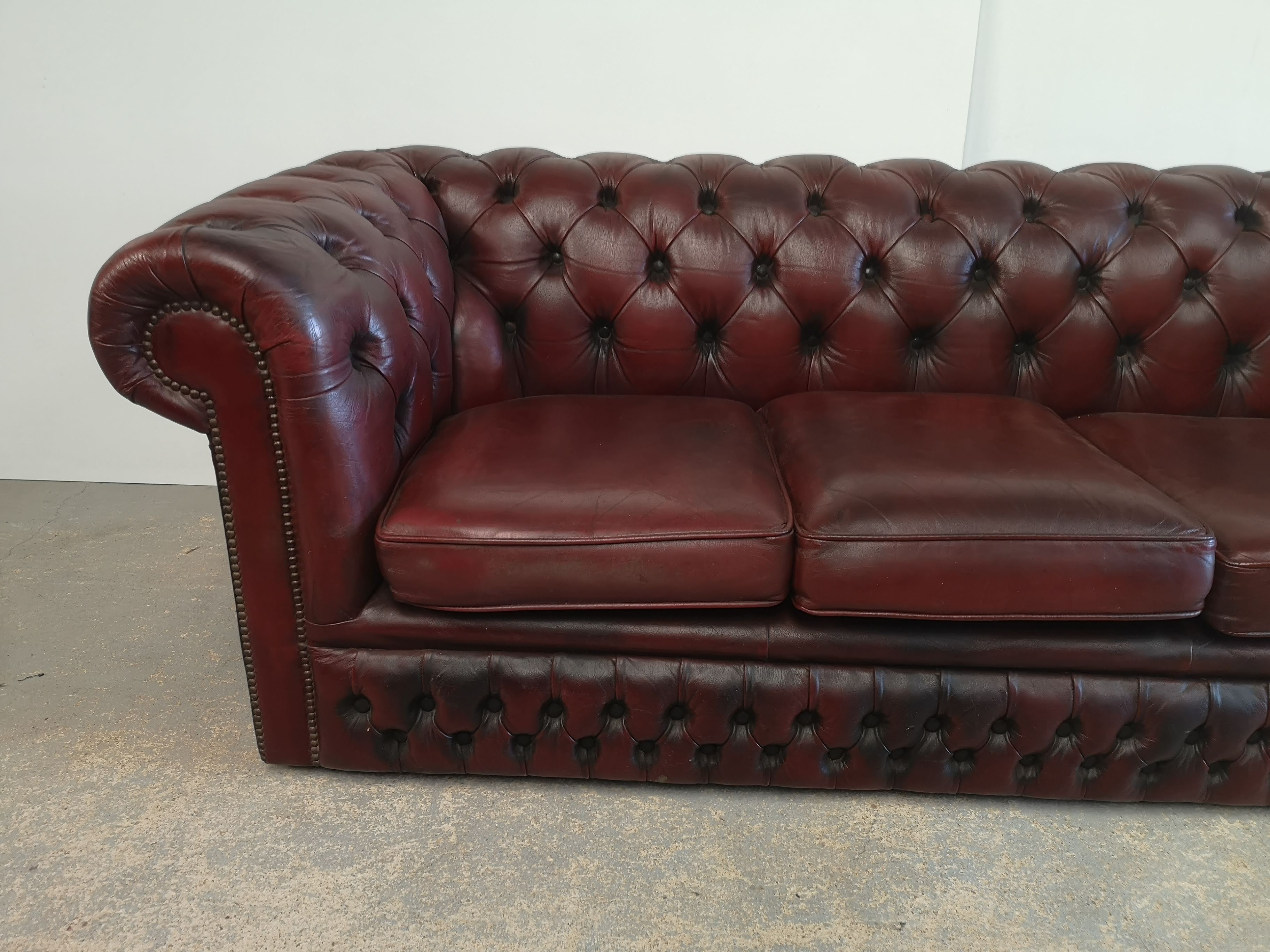 Burgundy leather chesterfield sofa