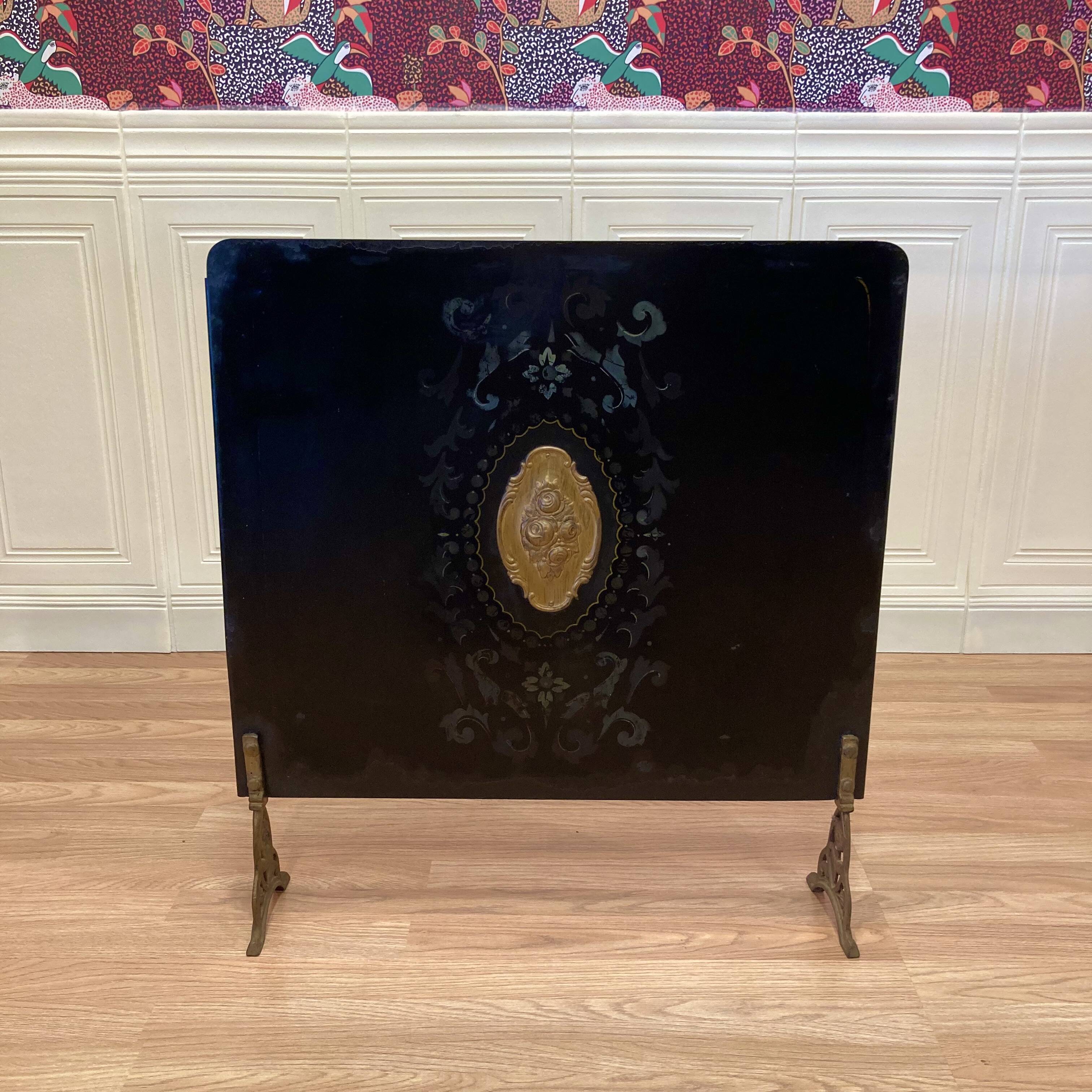 Antique metal fireplace screen.