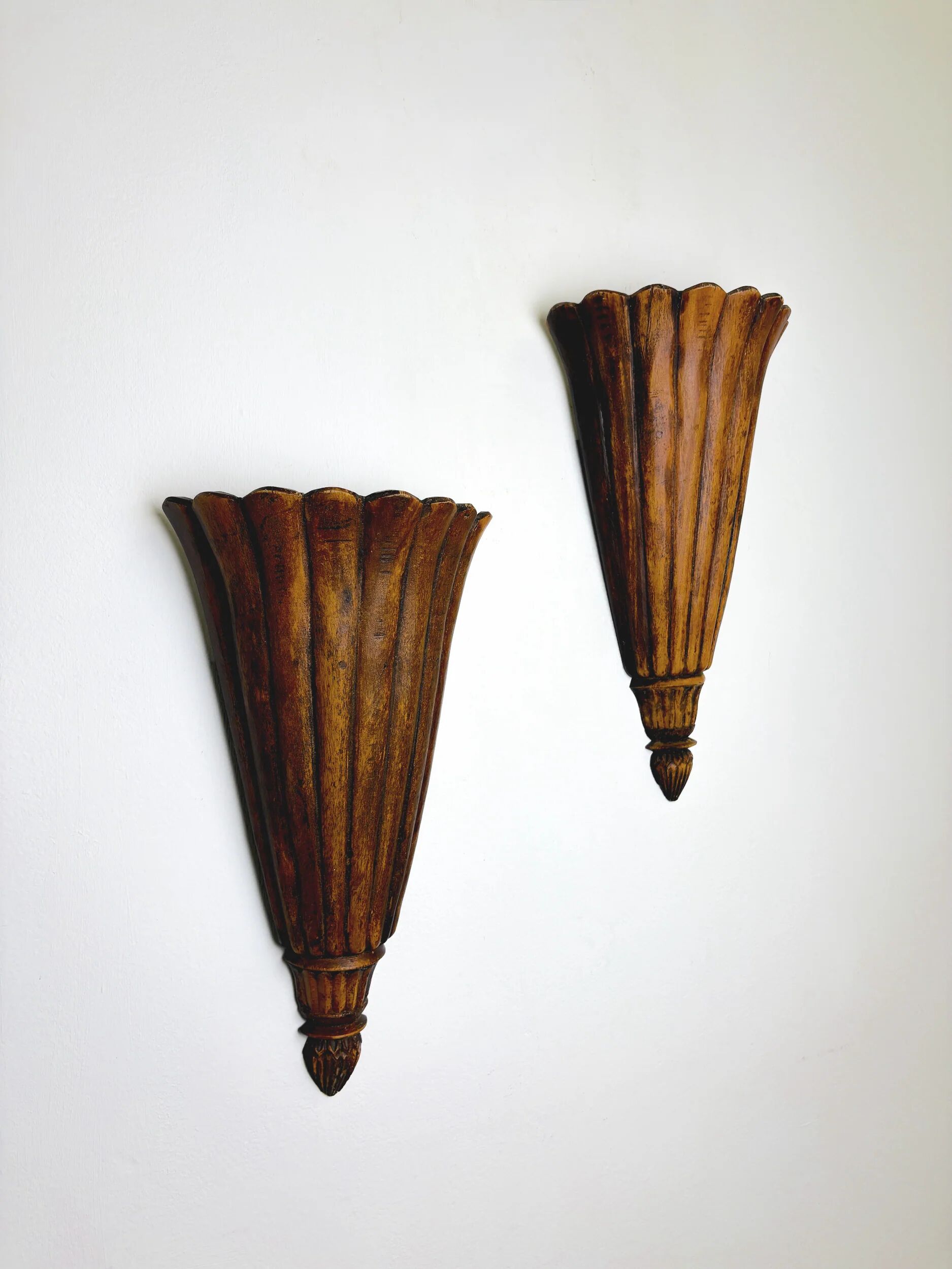 Pair of Art Deco carved wood wall sconces, France, 1930s