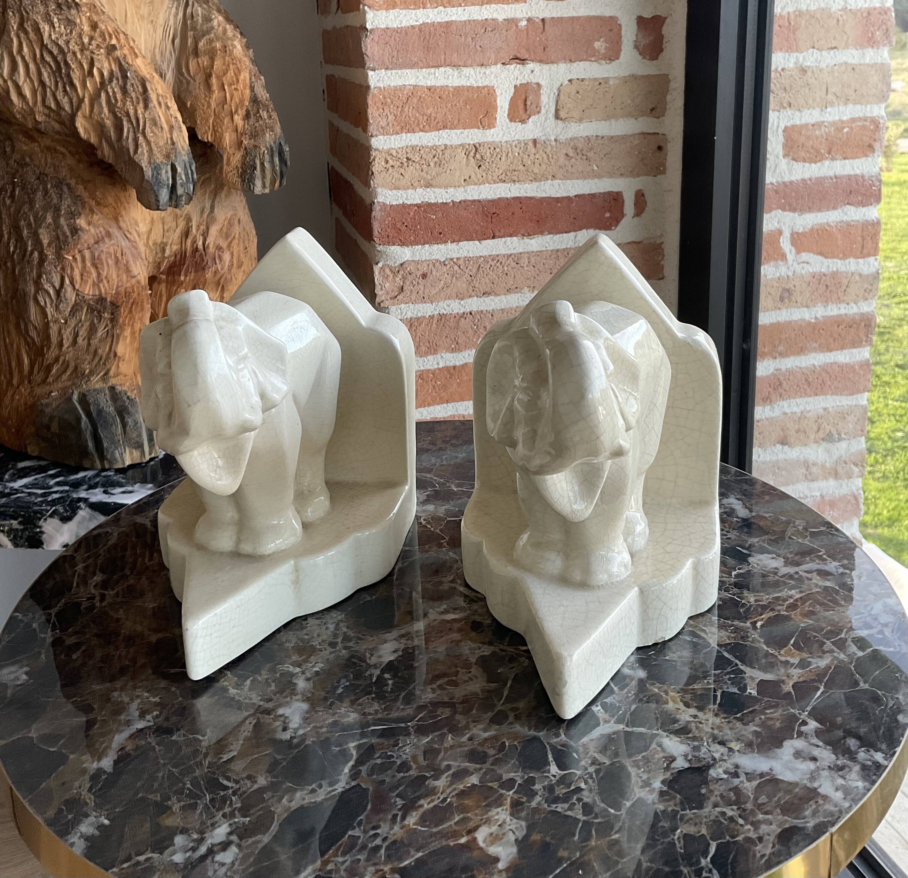 Pair of cracked earthenware bookends. ART DECO