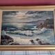 Large old oil painting depicting a seascape.
