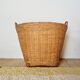 Storage basket for a plant pot in vintage rattan
