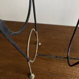 Mid-century poetic magazine rack in black metal