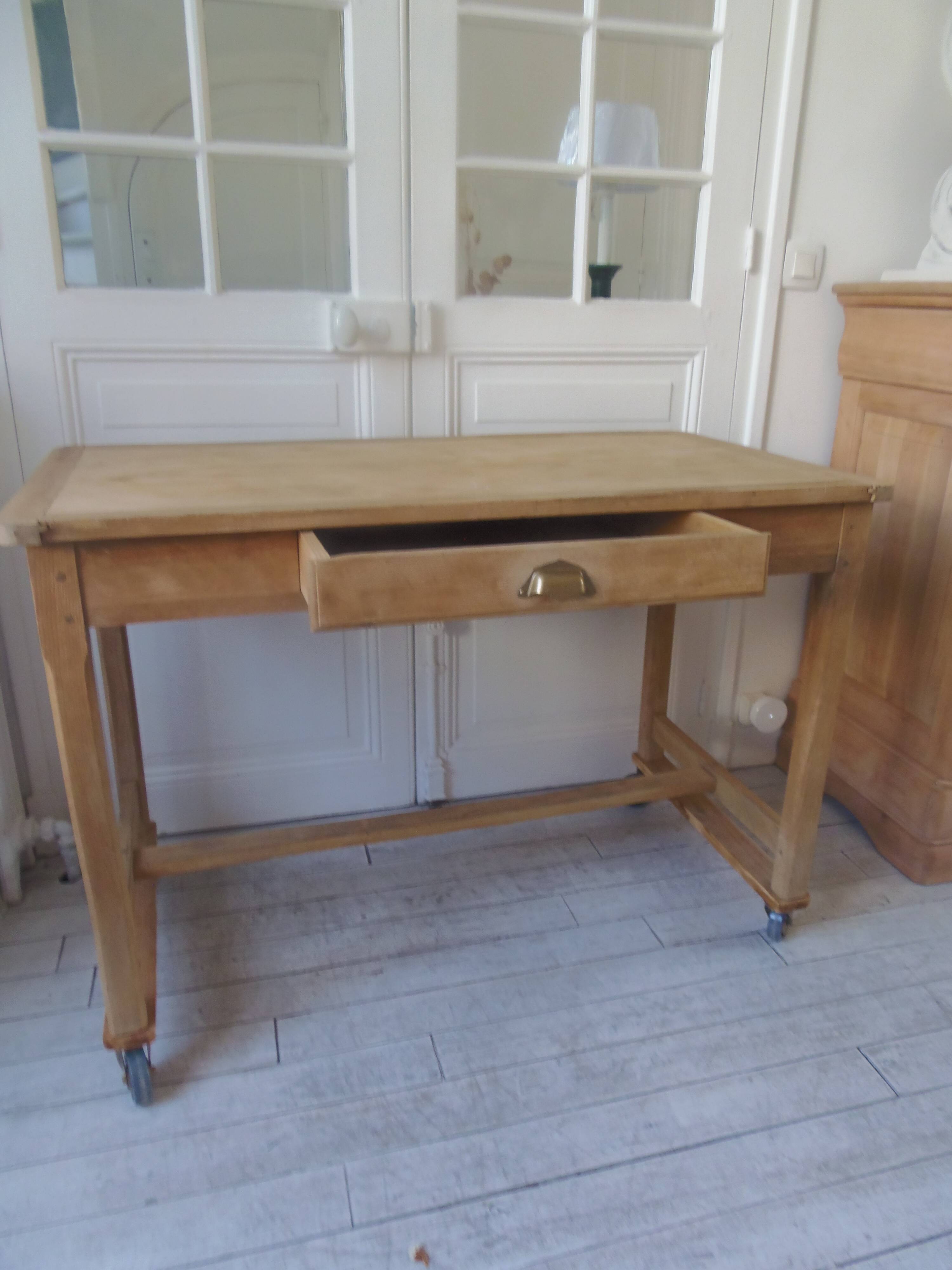 Vintage kitchen table on casters.