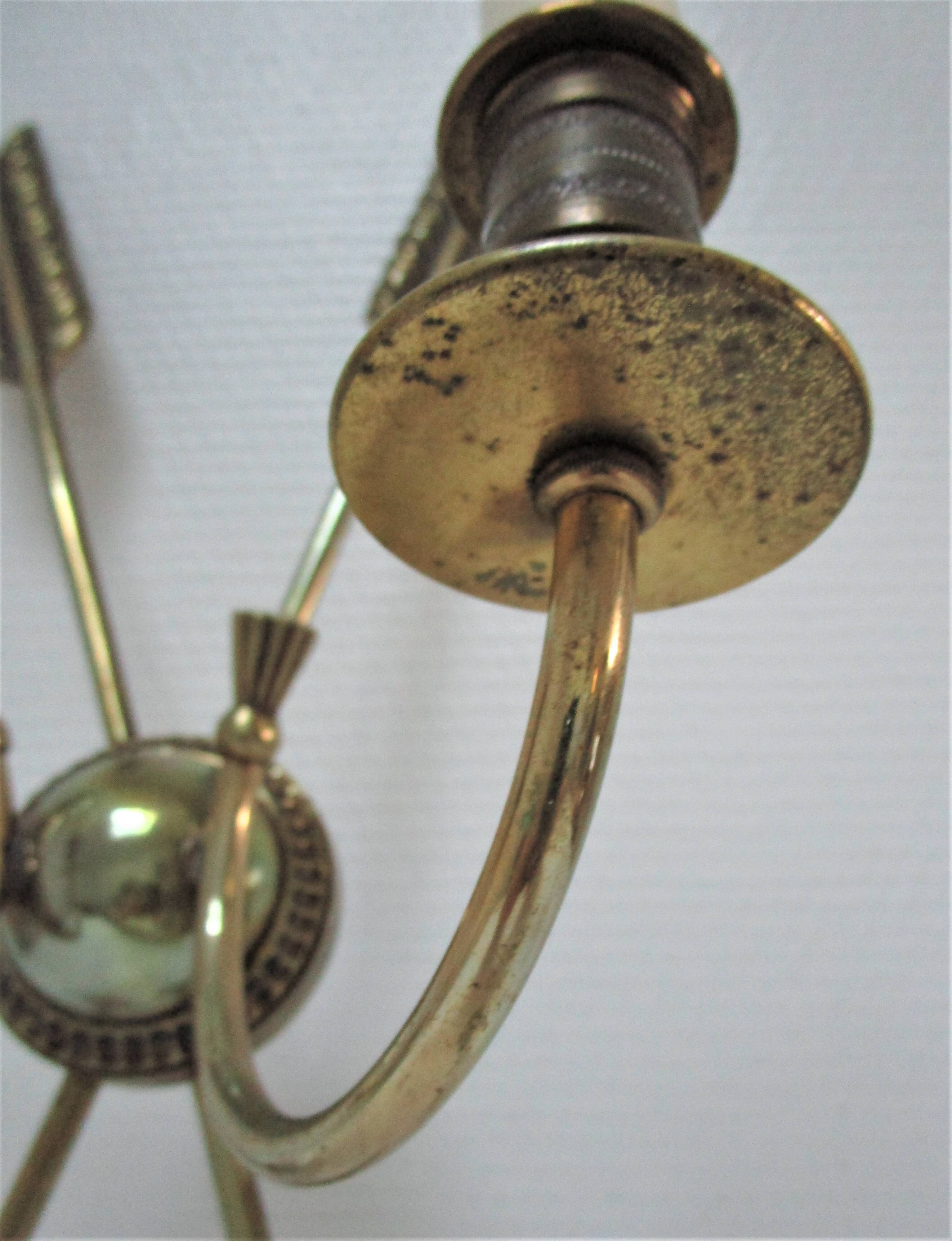 Pair of bronze crossed arrow wall lights Lucien Gau