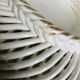 Covered basket in white woven ceramic and fruit slip.