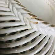 Covered basket in white woven ceramic and fruit slip.