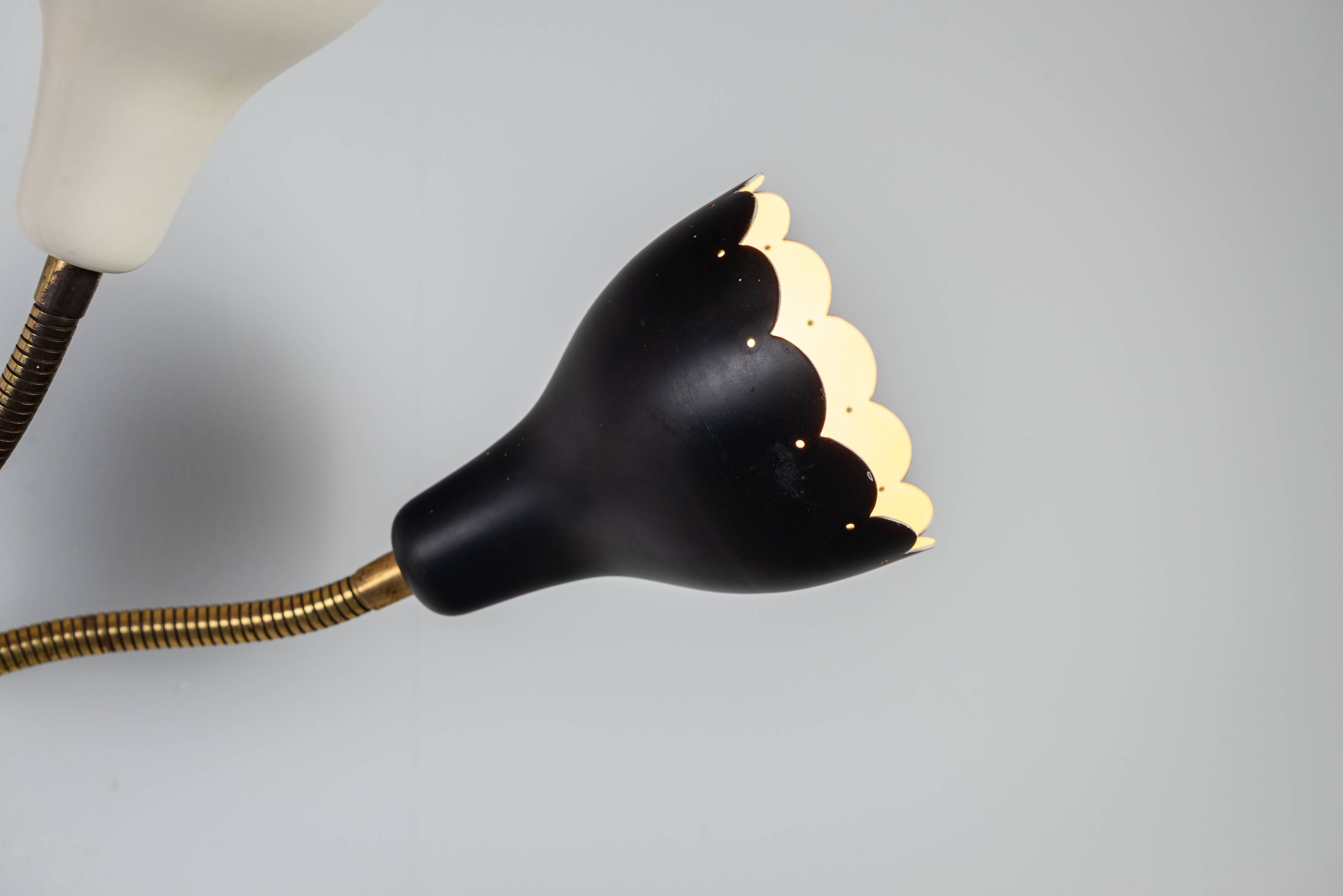 Adjustable wall lamp with three decorated shades in different colours