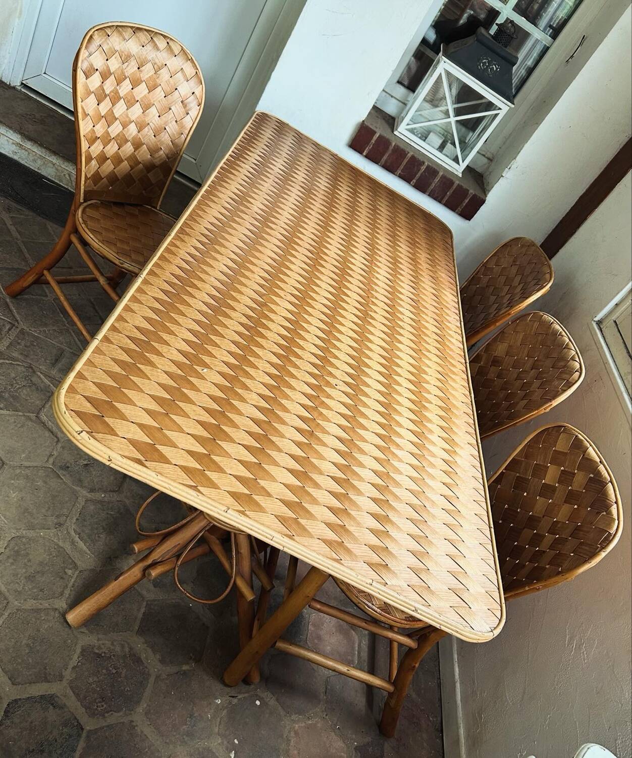 Table and chairs in woven chestnut