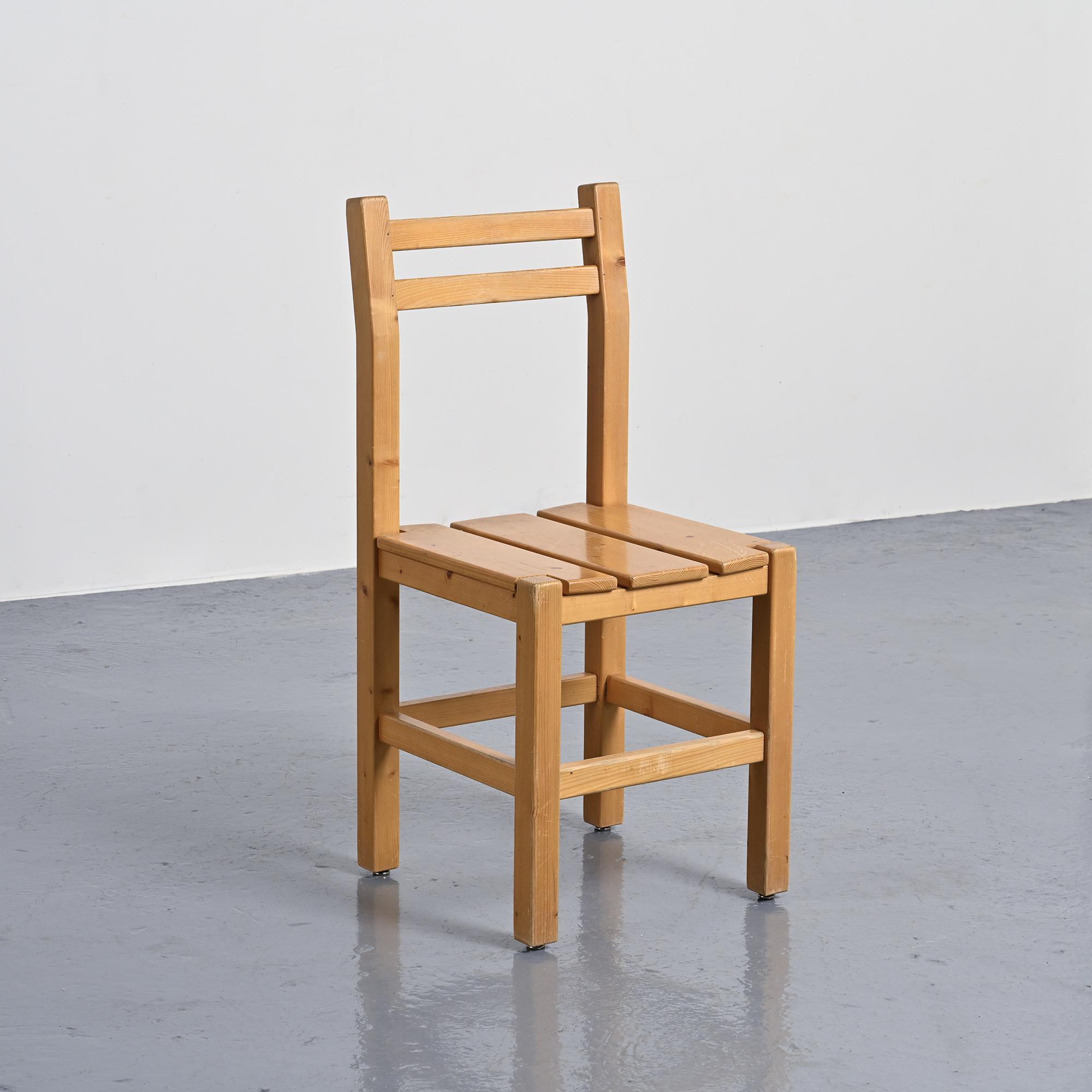 Set of four solid pine chairs by Maison Regain.