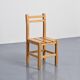 Set of four solid pine chairs by Maison Regain.