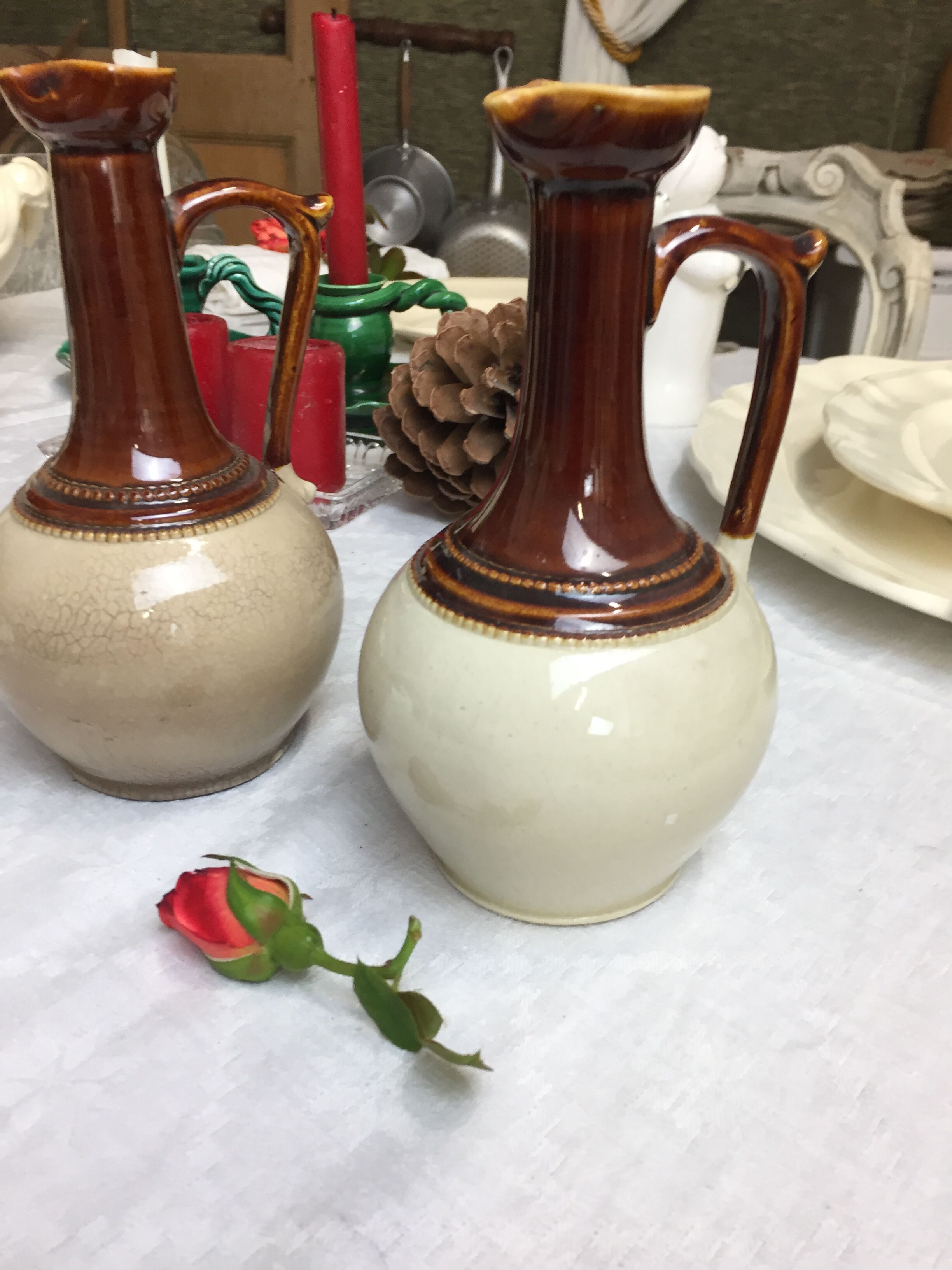 Antique handmade pitchers in beige and brown enamelled terracotta