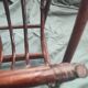 Dark rattan magazine rack