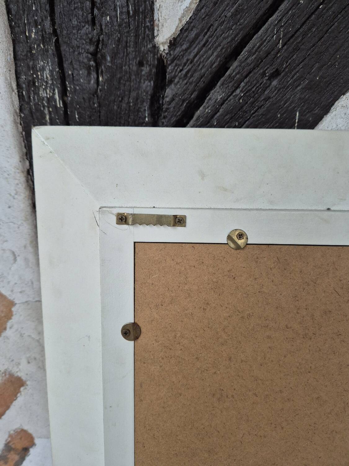 Oval mirror with a distressed white frame