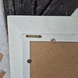 Oval mirror with a distressed white frame