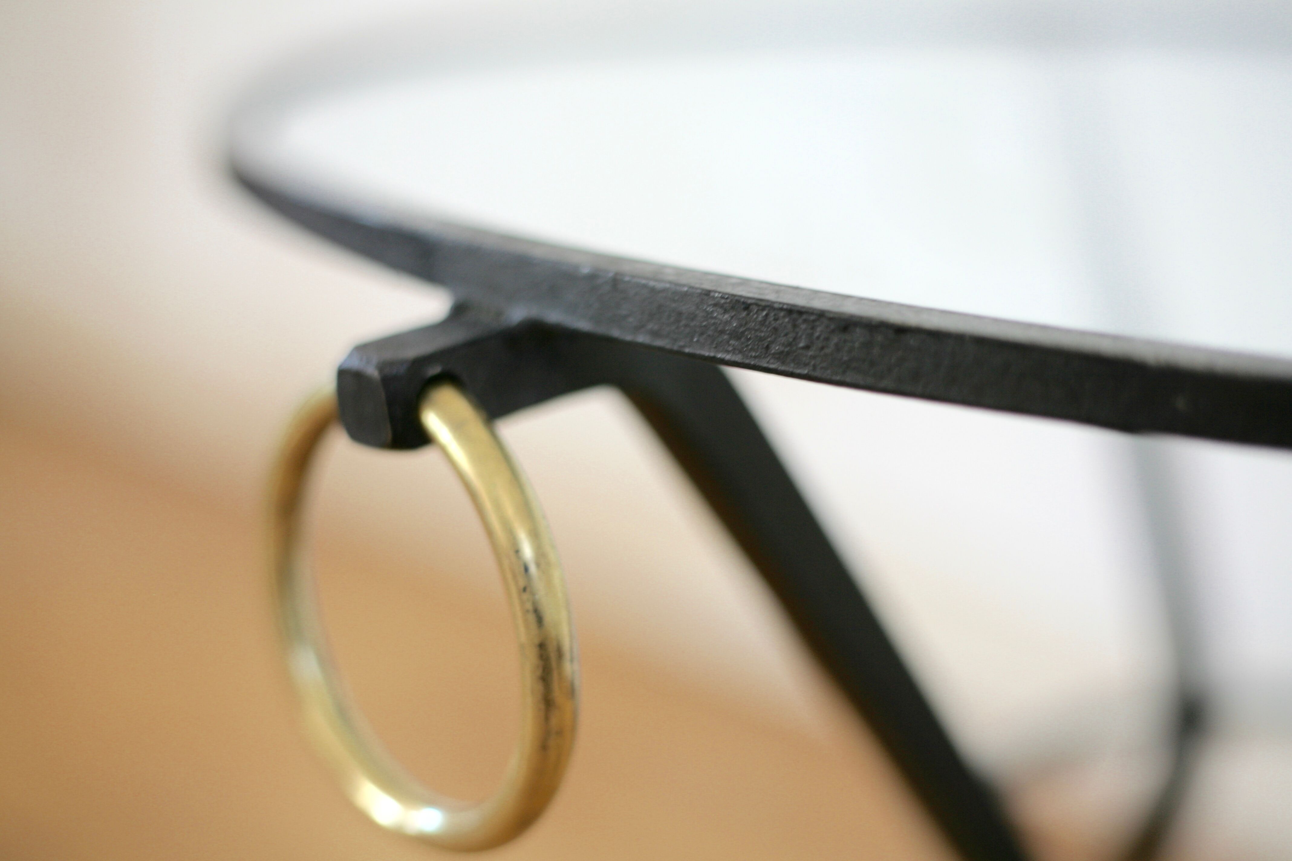 Coffee table black lacquered metal, glass and brass, France, circa 1950.