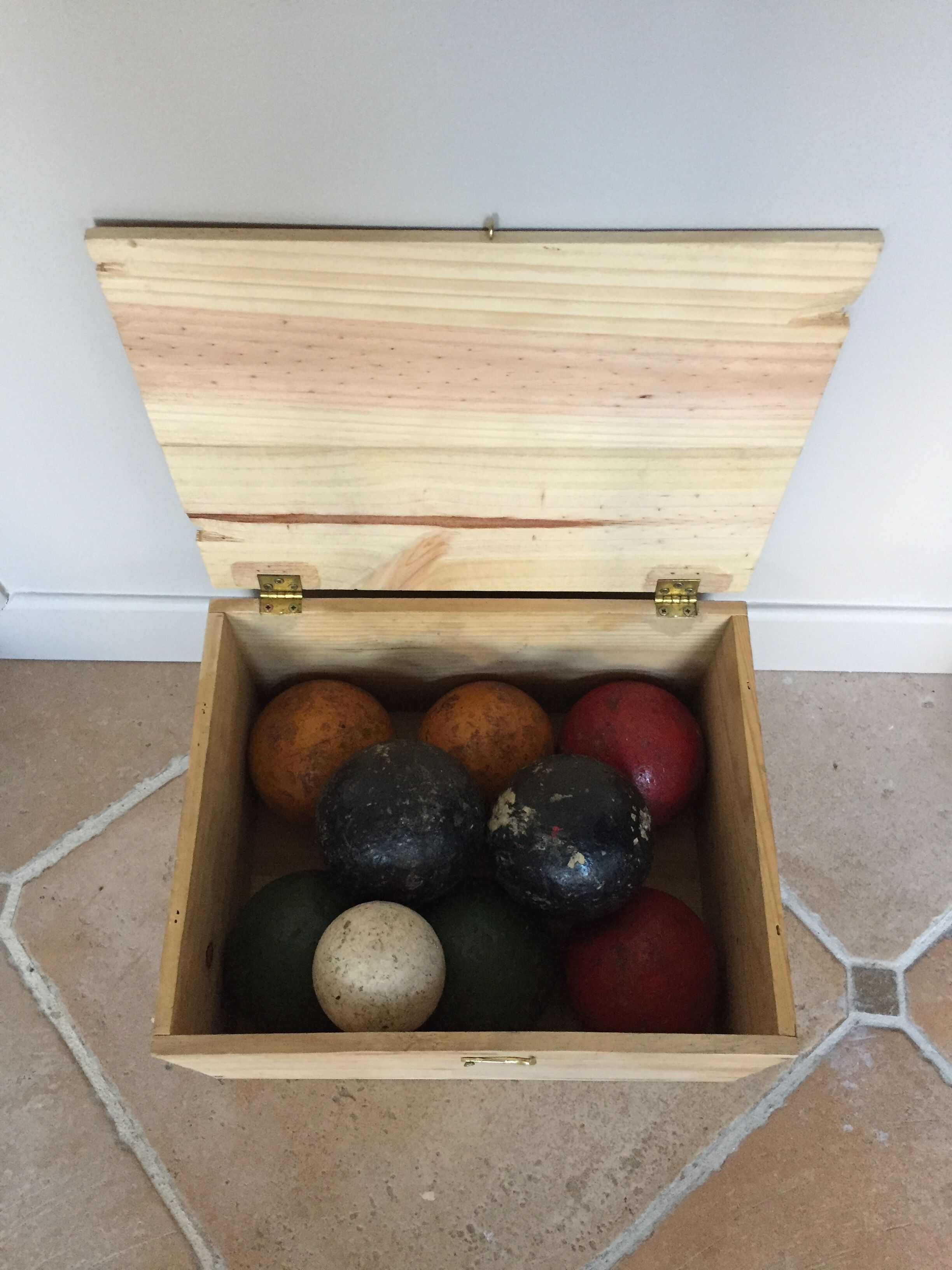 Very old game of wooden petanque balls with piglet