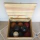 Very old game of wooden petanque balls with piglet