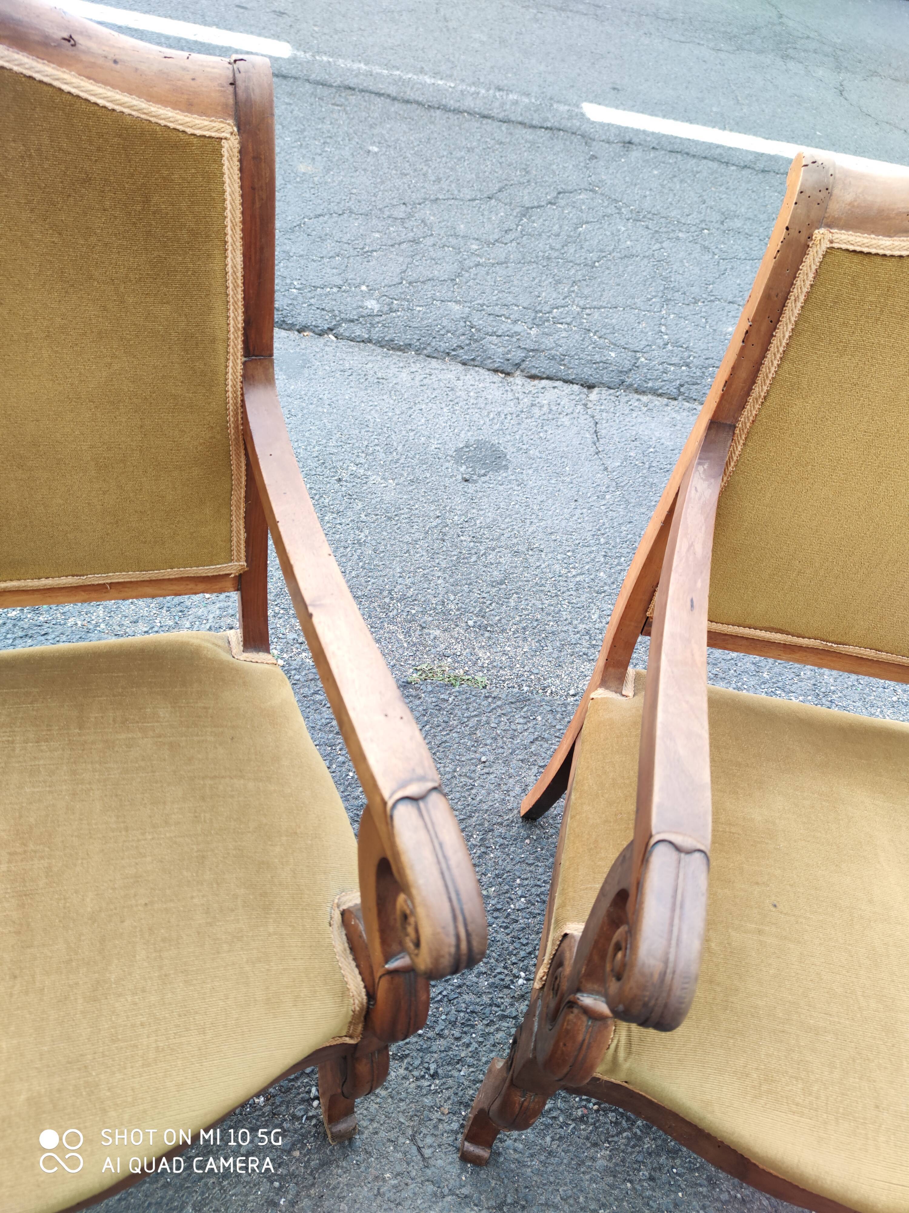Pair of walnut armchairs from the Consulate period