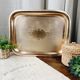 Golden and chiseled brass serving tray