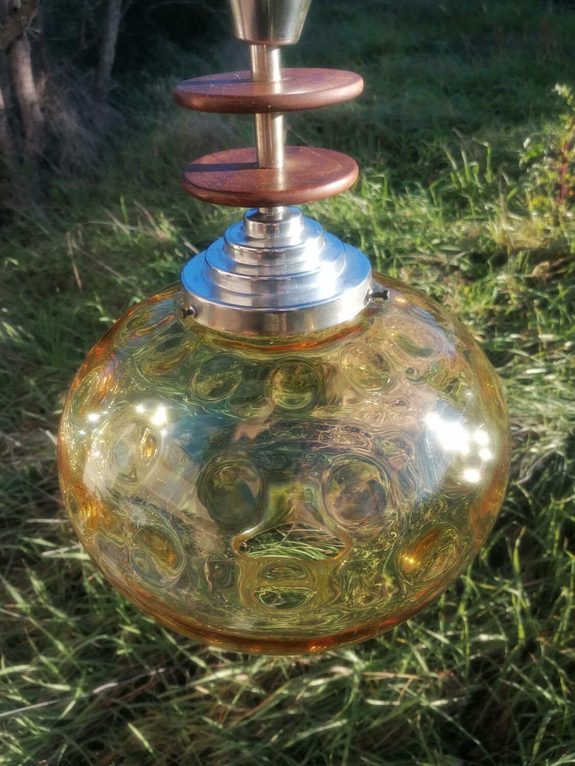 Vintage suspension ball in amber glass