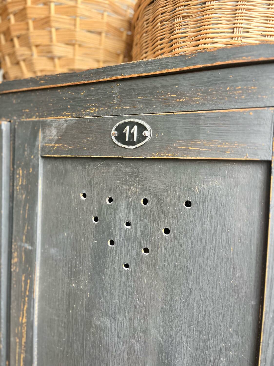 Old wooden locker with black patina
