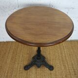 oak tray table with cast iron legs and pair of bistro chairs
