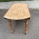 Renovated 18th century solid wood extendable round dining table with shutters