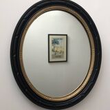 black and gold oval mirror
