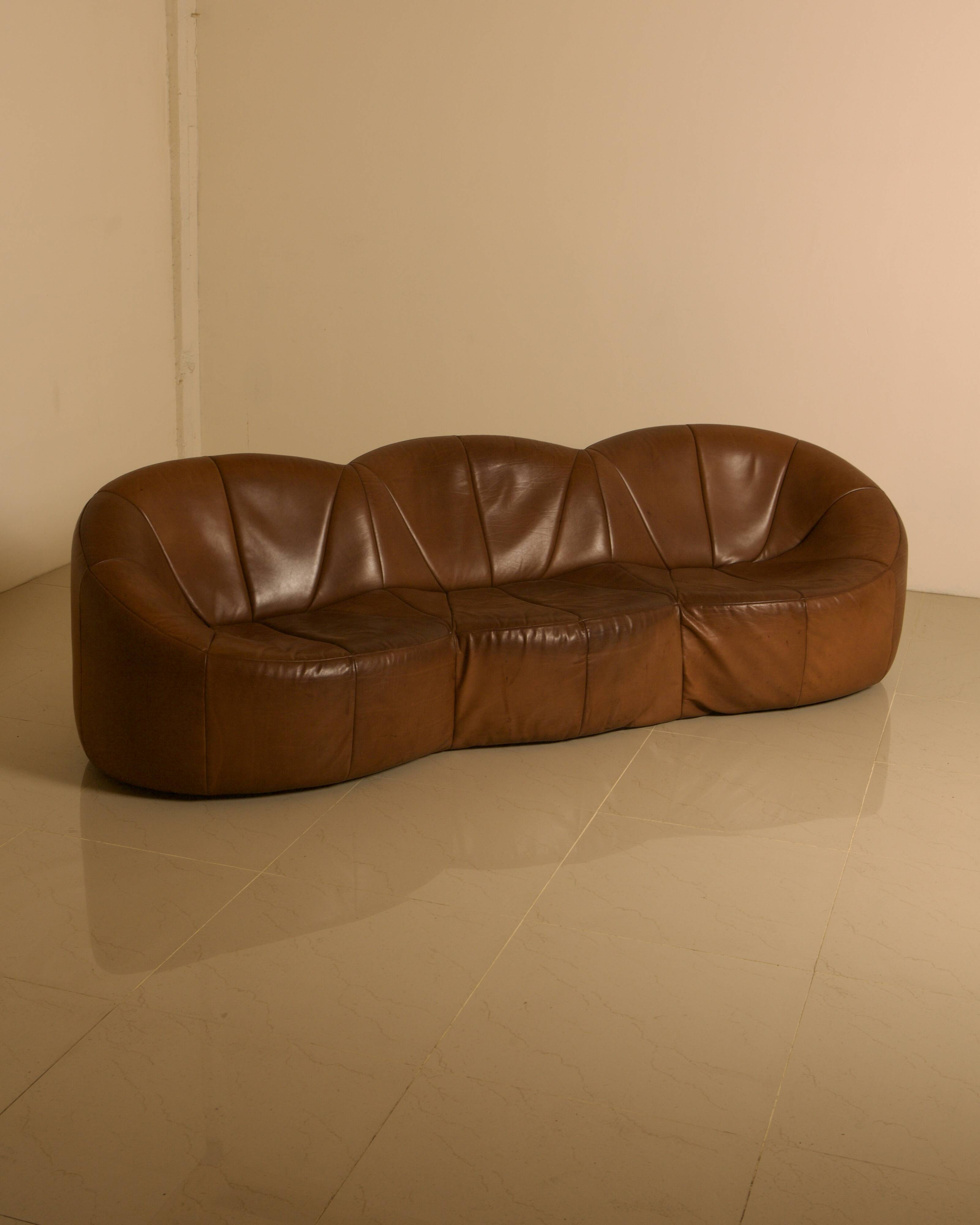"Pumpkin" 3-seater canapé in patinated brown leather by Pierre Paulin for Arti.