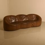 "Pumpkin" 3-seater canapé in patinated brown leather by Pierre Paulin for Arti.