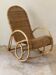 Fauteuil rocking-chair en rotin naturel.