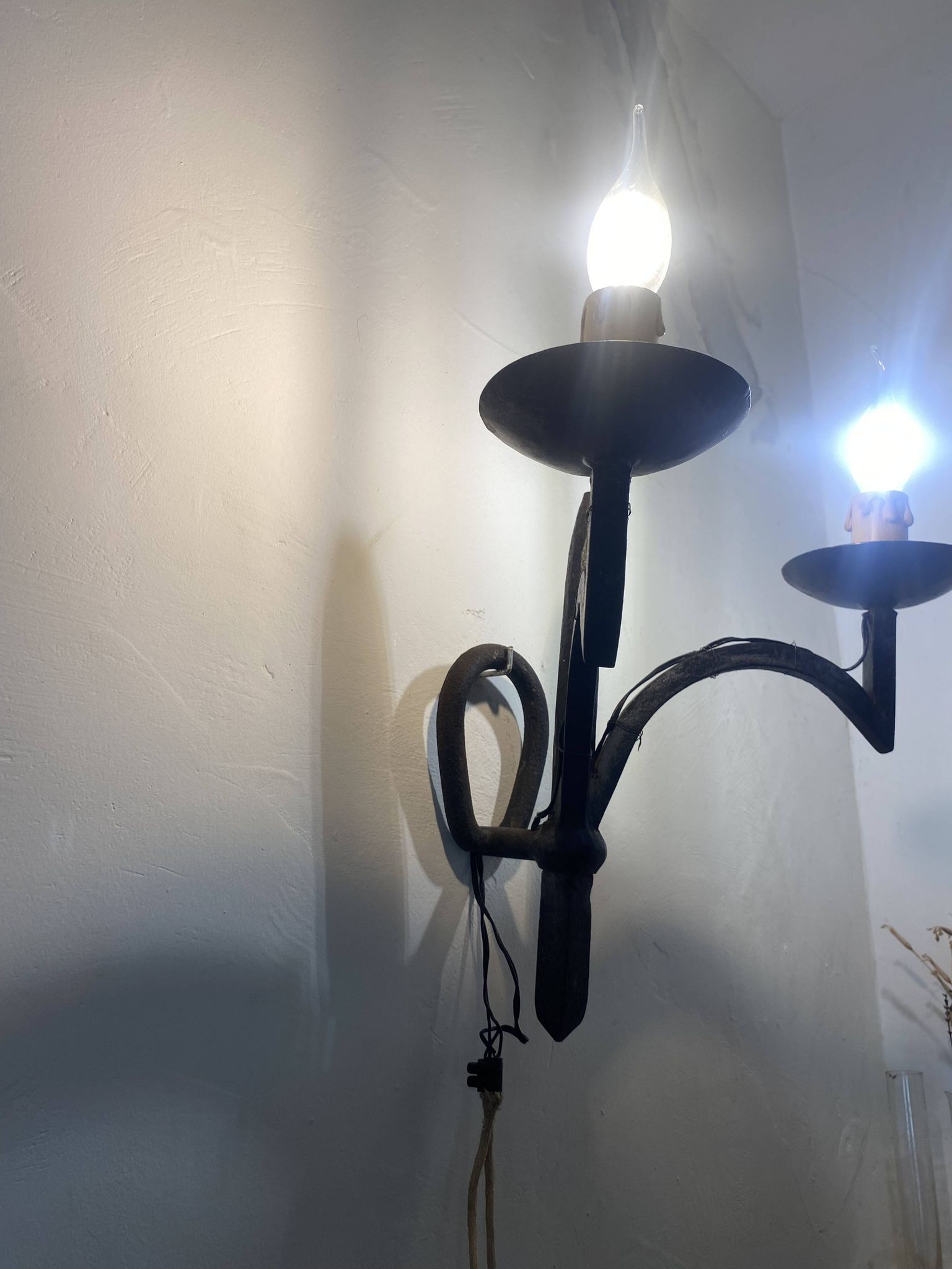 Wrought iron wall lights.