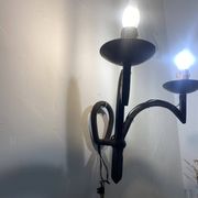 Wrought iron wall lights.