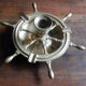 Brass ashtray and candlestick shaped boat bar