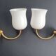 Pair of vintage gold-tone wall sconces with opaline glass globes