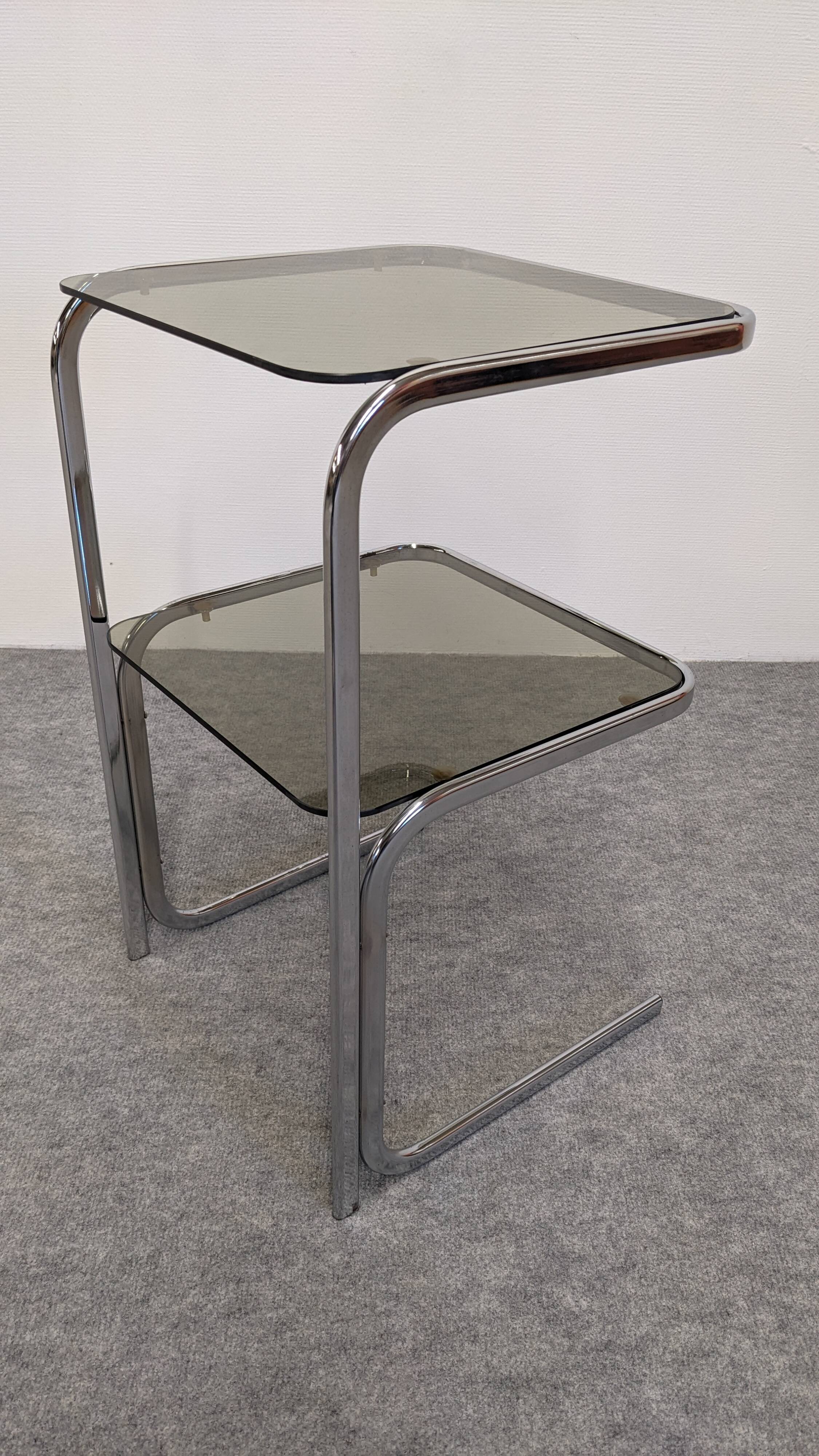 Chrome and smoked glass side table or end table, France circa 1970.